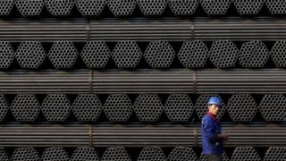 A worker at a steel pipe plant in Tangshan, China