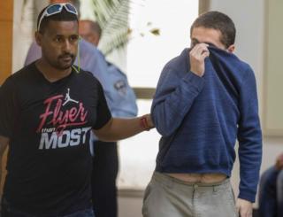Michael Ron David Kadar (pictured right) allegedly made hundreds of hoax bomb threats
