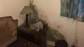 Bedroom with mould on the walls
