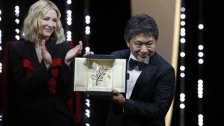 Hirozaku Kore-Eda accepts the Palm d'Or (Golden Palm) for the movie Shoplifters (Manbiki Kazoku) during the Closing Awards Ceremony