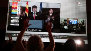 Other folks explore Carles Puigdemont after Catalonia's regional election in Brussels, on a huge hide hide in Barcelona, Spain, December 21, 2017