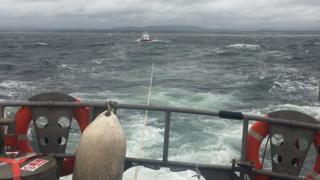 Lifeboat towing broken down dive support boat