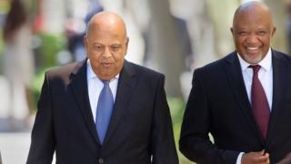 South Africa"s Minister of Finance Pravin Gordhan (L) and Deputy Finance Minister Mcebisi Jonas (R)