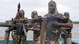 Militants wey carry gun.