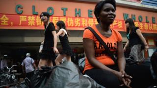 A Zambian vendor outside a wholesale store in China
