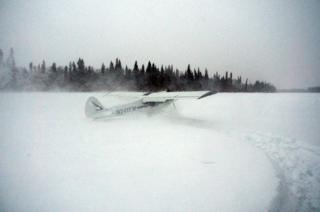The plane lands in snow
