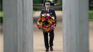 Metropolitan Police Commissioner Sir Bernard Hogan-Howe lays a wreath at the memorial in Hyde Park to mark the 11th anniversary of the 7/7 terrorist attacks on London