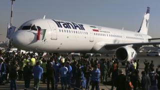 Pilot of IranAir's new Airbus plane waves national flag after landing at Mehrabad airport, Tehran. 12 Jan 2017