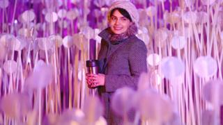 A woman walks through 'Entre Les Rangs', by Rami Bebawi and KANVA at Lewis Cubitt Park, King's Cross