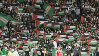Fans display Palestine flags at Celtic's Champions League play-off first leg against Hapoel Beer Sheva
