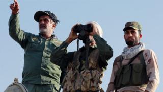 Members of an Iraqi Shiite militia inspect the frontline during a campaign against the Islamic State (IS) militants in the formerly IS held town of Zarka, 20 km west of Mosul, 31 October 2016