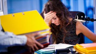 A woman stressed at work