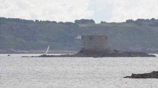 Yacht stranded on rocks off the Brehon Tower