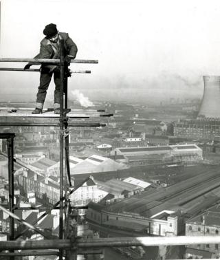 Scaffolder Douglas Tennant, from Barrowfield, photographed on scaffolding above Sauchiehall Street in 1964.
