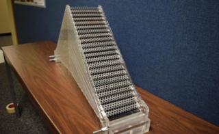 Prototype cloaking device made of out of perforated steel plates.