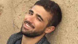 In this Nov. 1, 2014 file photo, freelance translator Mohammed Rasool is pictured during a break while working with an Associated Press team in Suruc, Turkey. In August 2015,