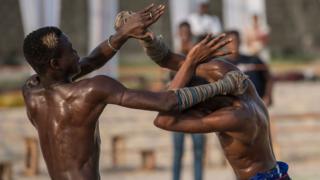 Two young Dambe boxers fight during the Dambe Warriors Tournament held in Lagos on March 2, 2018. Dambe, a brutal style of fighting where one wrapped fist is a designated spear and the other a shield, is traditionally practised by Hausas in Nigeria"s north