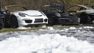 Burnt cars are seen at a Porsche showroom where a fire broke overnight ahead of the G20 summit in Hamburg, Germany, July 6, 2017.