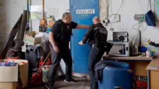 Police at one of the yards