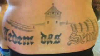 German politician guilty over Auschwitz tattoo - BBC News