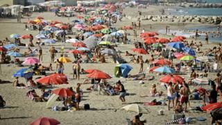 Holidaymakers on a beach