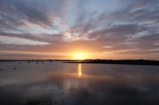 Sunrise reflected in water