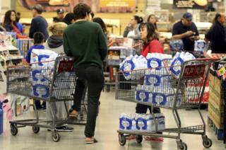 shoppers buy water