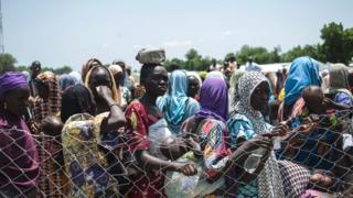 Women and children queue to enter a Unicef nutrition clinic in Borno state - September 2016