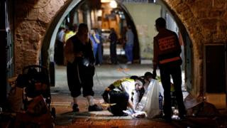 Investigators at the site of an attack where two Israelis were killed and two wounded, Jerusalem (3 October)