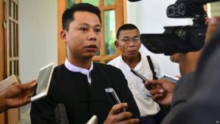 Arnt Khaung Min, deputy chief editor of the weekly Myanmar Herald, speaks to journalists as he leaves a township court in Naypyitaw, Myanmar, Tuesday, July 21, 2015.