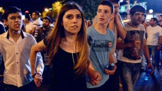 Anti-government protesters, supporters of the armed group who have been holed inside a police station, march through a street in Yerevan, Armenia, Saturday, July 30, 2016