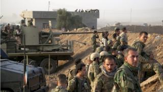 Kurdish Peshmerga soldiers take up positions, south of Kirkuk, northern Iraq, 06 July 2015