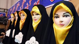 Headscarves are displayed on mannequins at an Islamic fashion exhibit in central Tehran on 18 December 2014