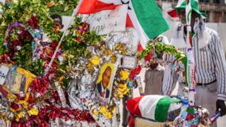 A man pushes a wheelbarrow through the streets as Somaliland celebrates its independence