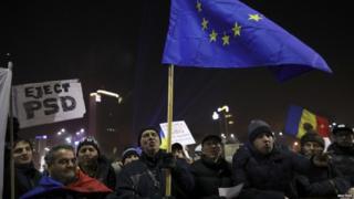 Protesters hold EU flag during a demonstration in Bucharest, Romania, February 5, 2017.