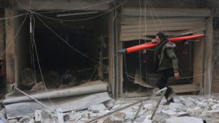 Bombed out windows in the aftermath of a reported air strike in the Syrian city of Aleppo