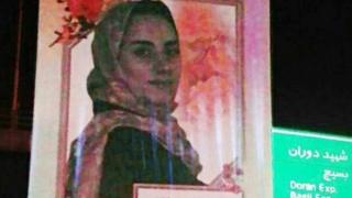 Prize-winning mathematician Maryam Mirzakhani appearing on a billboard in Tehran
