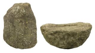 Phallus carving from the front and side