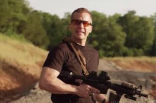 Greitens holding a gun