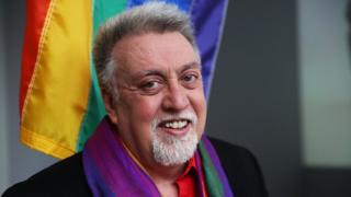 Rainbow Flag Creator Gilbert Baker poses at the Museum of Modern Art (MoMA) on January 7, 2016 in New York City.