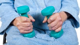 Using dumbbell weights to exercise muscles