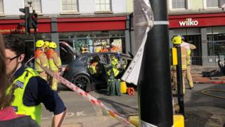 Firefighters at the scene of a car incident