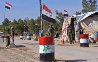 Syrian government forces guard a checkpoint after taking control of the village of Shamer on the northeastern outskirts of Aleppo on 7 March, 2017.