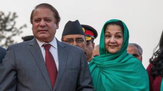 Prime Minister of Pakistan Nawaz Sharif poses with his wife Kalsoom Nawaz Sharif upon his arrival for the 18th SAARC Summit on November 25, 2014 in Kathmandu, Nepal