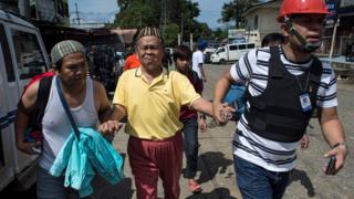 Evacuated residents arrive at a checkpoint in Marawi City on the southern island of Mindanao