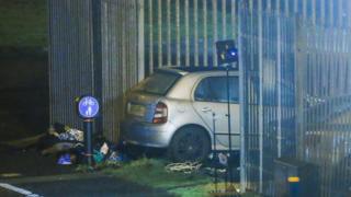 A car crashed into a fence