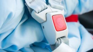A baby's car seatbelt