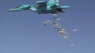 A still image, taken from video footage released by the Russian Defence Ministry on 18 August 2016, shows a Russian Sukhoi Su-34 strike fighter based in Iran dropping bombs on Deir al-Zour province in Syria