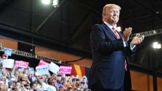 US President Donald Trump arrives to speak at a "Make America Great Again" rally in Phoenix, Arizona, on August 22, 2017