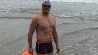 Stuart Hindes at edge of sea